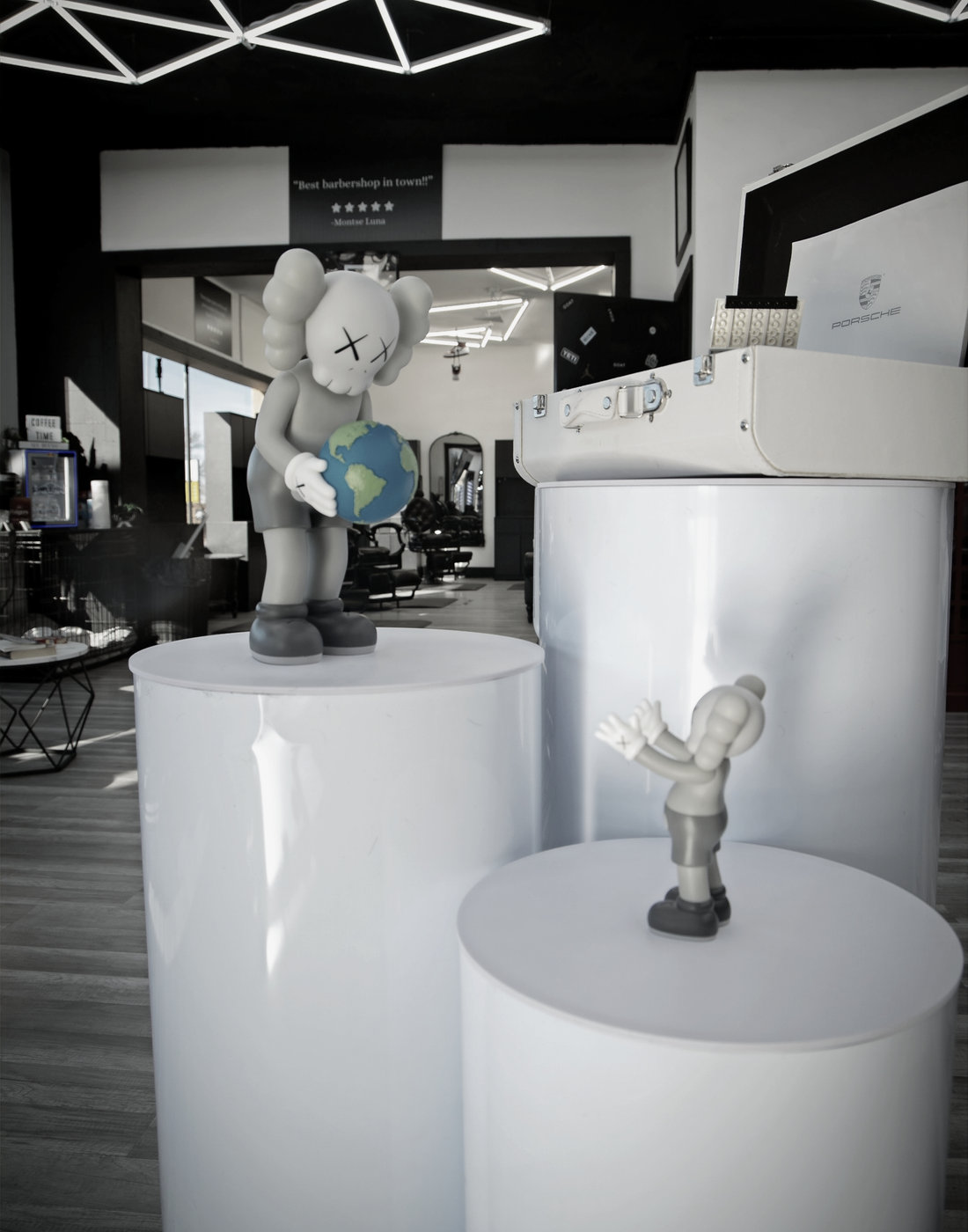 Collectible art displayed on plinths inside the shop